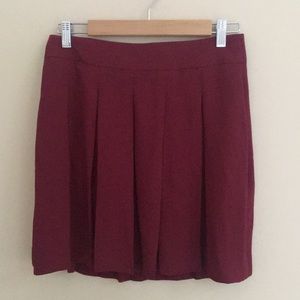 Pleated maroon mini-skirt